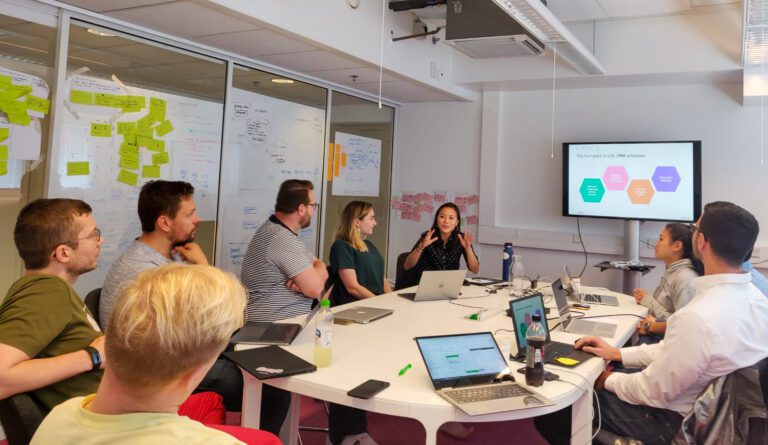 A group of people listening to a presentation