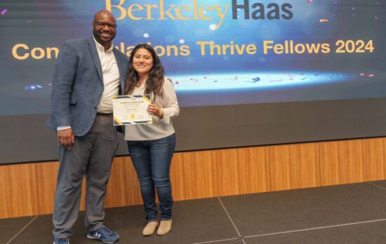 Graduate receiving her certificate at the Haas Thrive Fellows commencement