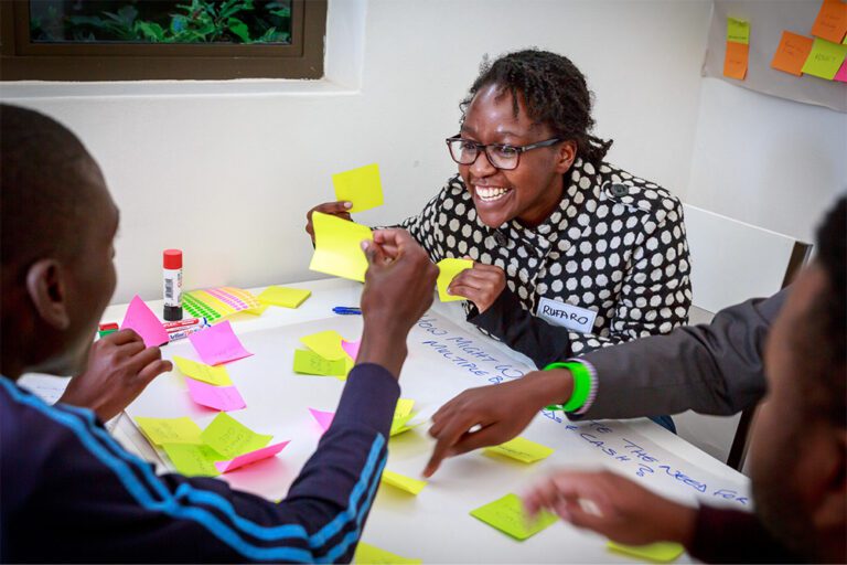 A woman working with sticky notes