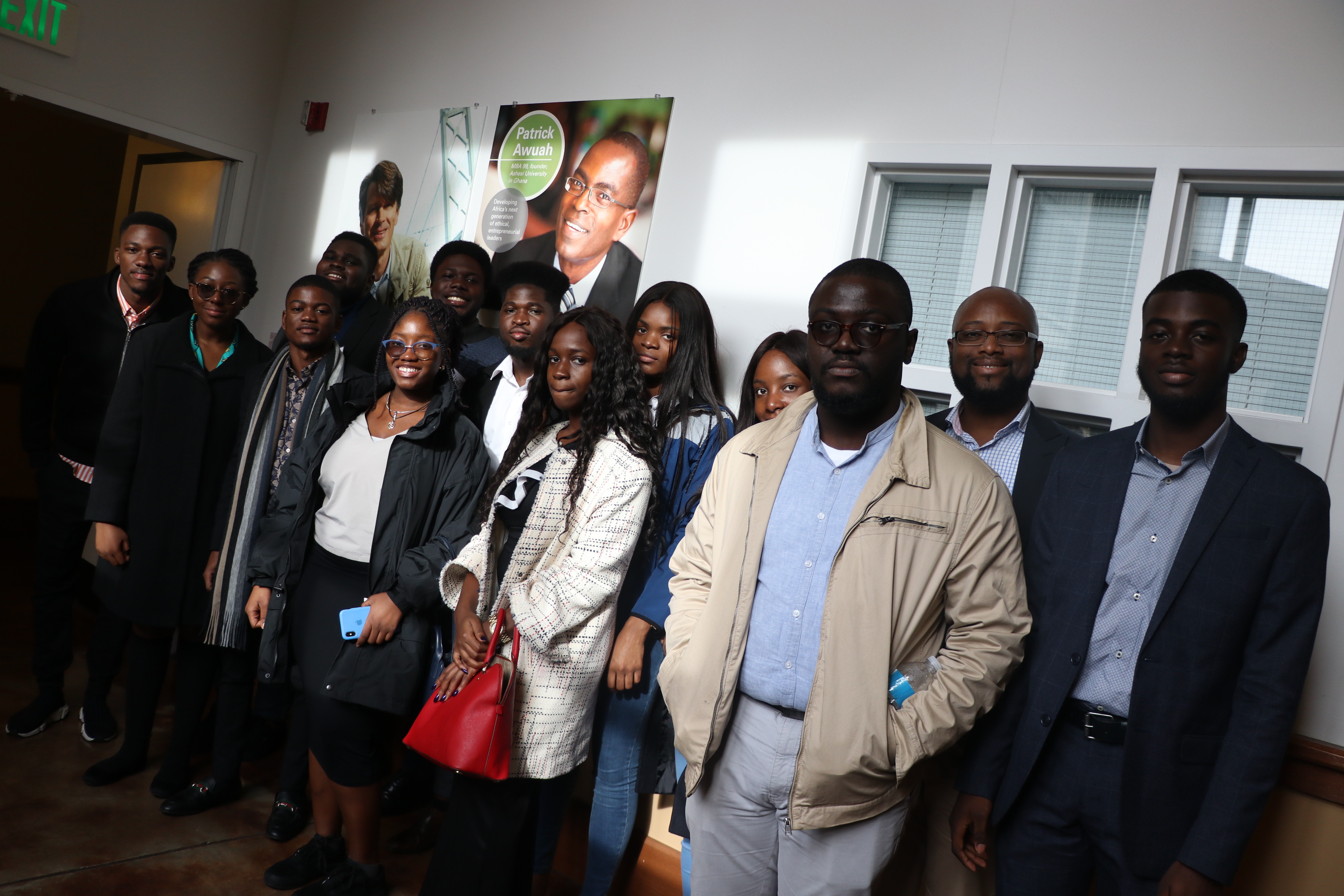 Professor Gordon Adomdza and his students with photo of Patrick Awuah on the walls of Haas