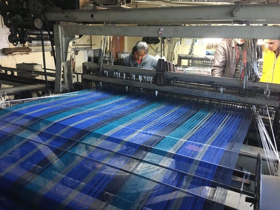 Loom with person working on the far side